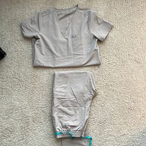 Beige colored Figs. Brand new. Never worn! Size medium